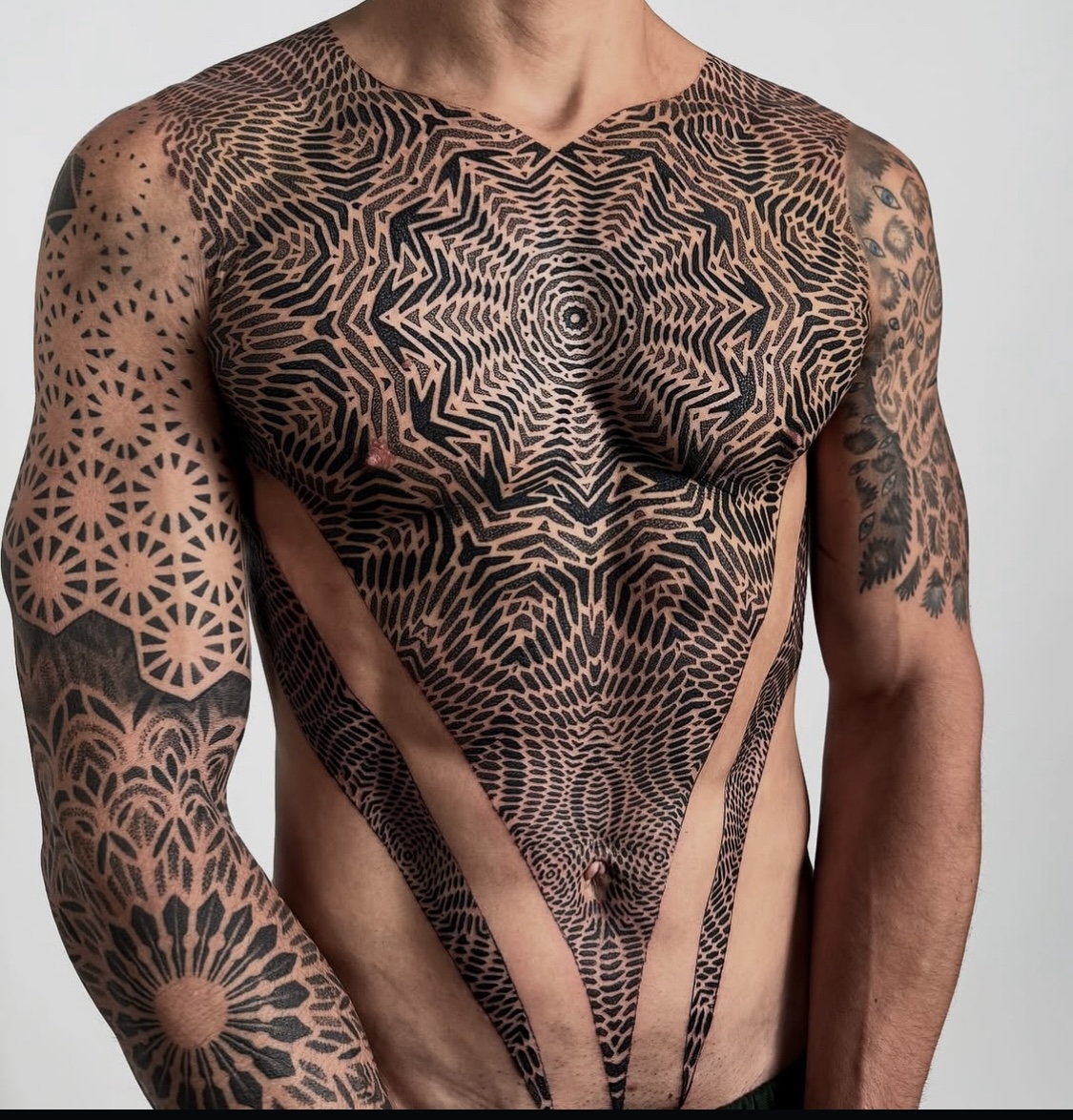 Large ornamental geometric chest tattoo by Dezso Jakab