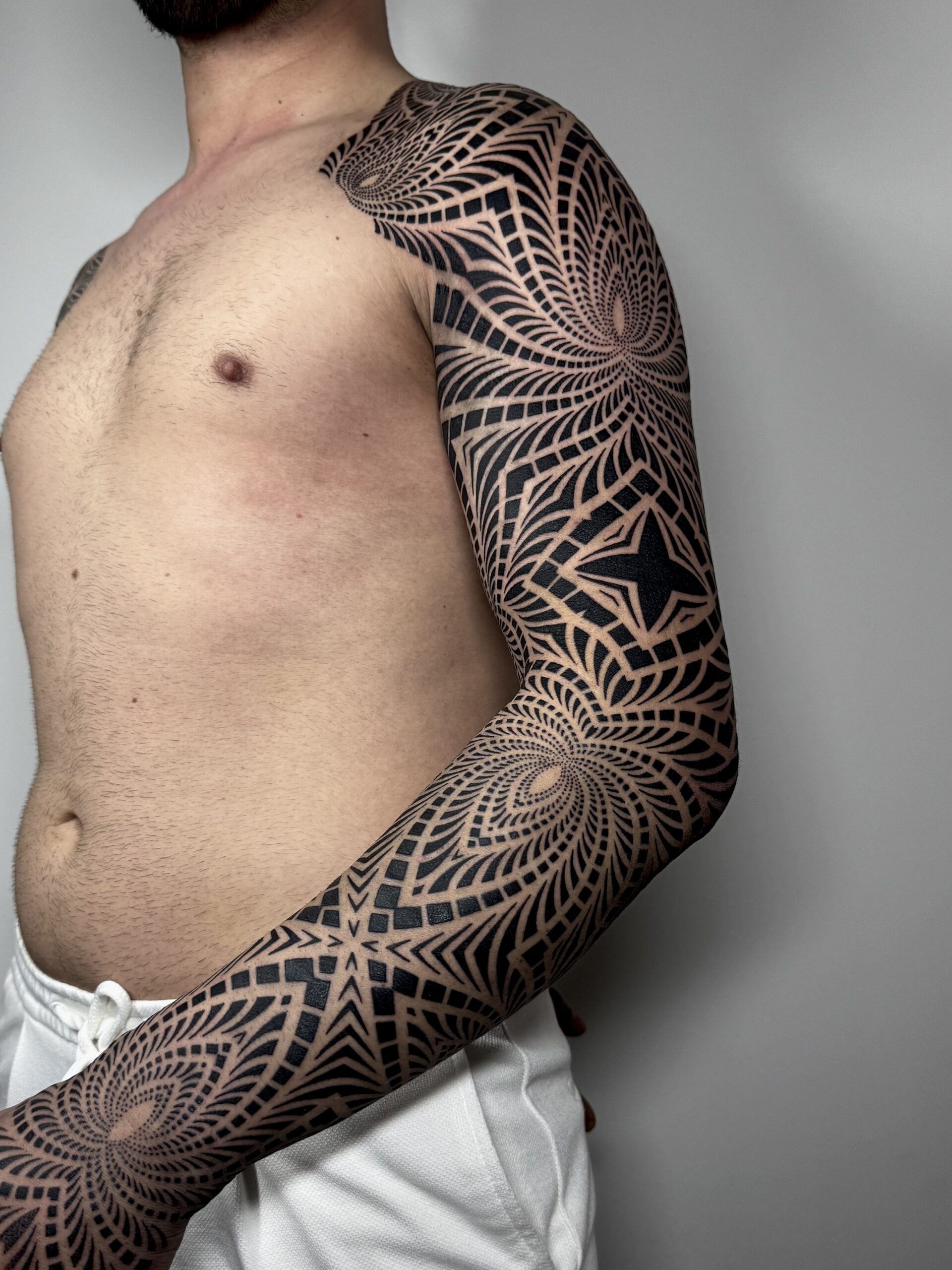 Geometric sleeve tattoo by Dezso Jakab
