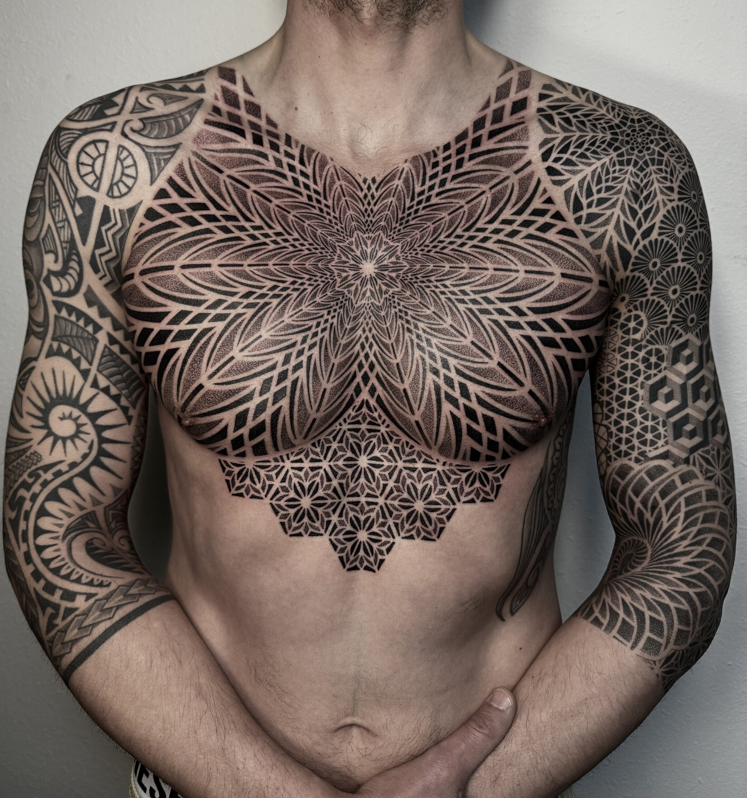 Detailed ornamental torso tattoo by Dezso Jakab